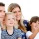 Smiling family watching a film at television Smiling family watching a film at television
